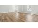 Spacious unfinished basement with wood floors and natural light from windows, ideal for customization at 230 Sutherland Dr, Franklinton, NC 27525