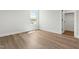 Bedroom with wood-look flooring and a large window for natural light at 230 Sutherland Dr, Franklinton, NC 27525