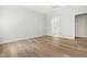 Bright bedroom features wood-look flooring and access to an ensuite bathroom at 230 Sutherland Dr, Franklinton, NC 27525
