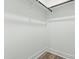 Bright walk-in closet with a hanging rod and wood-look flooring at 230 Sutherland Dr, Franklinton, NC 27525
