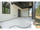 Covered patio with concrete flooring and open views of the backyard and surrounding landscape at 230 Sutherland Dr, Franklinton, NC 27525