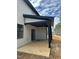 Covered outdoor porch featuring sturdy black posts and sliding glass doors at 230 Sutherland Dr, Franklinton, NC 27525