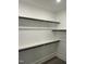 Spacious walk-in closet with custom shelving and rod, offering ample storage at 230 Sutherland Dr, Franklinton, NC 27525