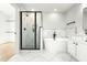 Luxurious bathroom featuring a glass enclosed shower, free standing tub, and modern tile work at 240 Sutherland Dr, Franklinton, NC 27525