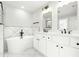 Modern bathroom featuring a soaking tub, dual vanity, and sleek black fixtures at 240 Sutherland Dr, Franklinton, NC 27525