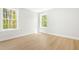 Light-filled bedroom with wood floors and scenic views, creating a cozy retreat at 240 Sutherland Dr, Franklinton, NC 27525