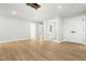 Spacious bonus room featuring plank flooring, large doors, and access to a bathroom at 240 Sutherland Dr, Franklinton, NC 27525
