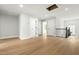 Bright bonus room featuring hard wood floors, white trim and several white doors at 240 Sutherland Dr, Franklinton, NC 27525