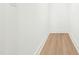 Narrow hallway with light colored hard wood flooring at 240 Sutherland Dr, Franklinton, NC 27525