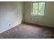 Standard size bedroom with a window view to the outdoors at 2408 Stadium Dr # A, Durham, NC 27704