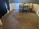 Dining area with carpet, chair railing, and natural light at 2408 Stadium Dr # A, Durham, NC 27704