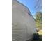 Side of the home needing repair with dirty siding and possible fire damage to a home on a sunny day at 2408 Stadium Dr # A, Durham, NC 27704