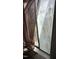 Close-up of a window covered with film and partially obscured by a curtain at 2408 Stadium Dr # A, Durham, NC 27704