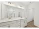 Modern bathroom featuring dual sinks, sleek countertops, and a glass-enclosed shower for a luxurious feel at 269 Marvel Dr # 138, Rolesville, NC 27571