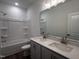 Bright bathroom featuring double vanity, shower-tub combination, and modern fixtures at 269 Marvel Dr # 138, Rolesville, NC 27571