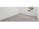 Bedroom with neutral carpet and white walls, featuring a window that lets in natural light at 269 Marvel Dr # 138, Rolesville, NC 27571