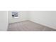 An empty bedroom is shown with plush carpet and a window providing natural light at 269 Marvel Dr # 138, Rolesville, NC 27571