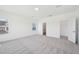 Spacious bedroom with ample natural light, neutral tones, and access to an en-suite bathroom at 269 Marvel Dr # 138, Rolesville, NC 27571