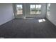 Bright bedroom featuring plush carpet and large windows providing natural light and outdoor views at 269 Marvel Dr # 138, Rolesville, NC 27571