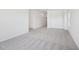 Spacious bedroom featuring neutral carpet and white walls that create a bright and airy ambiance at 269 Marvel Dr # 138, Rolesville, NC 27571