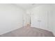 Comfortable bedroom with neutral carpet, closet doors, and natural light creates a calming retreat at 269 Marvel Dr # 138, Rolesville, NC 27571