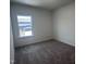 Cozy bedroom featuring soft carpet and a window with a view of the outdoors at 269 Marvel Dr # 138, Rolesville, NC 27571