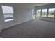 Spacious bedroom with plush carpet and multiple windows offering views of the surrounding neighborhood at 269 Marvel Dr # 138, Rolesville, NC 27571