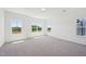 Sunlit bedroom featuring large windows, neutral walls, and plush carpeting, offering a serene atmosphere at 269 Marvel Dr # 138, Rolesville, NC 27571