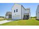 The white exterior features a garage, AC unit, and screened in porch, creating a welcoming space at 269 Marvel Dr # 138, Rolesville, NC 27571
