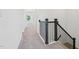 Upstairs hallway featuring carpet floors and a modern railing at 269 Marvel Dr # 138, Rolesville, NC 27571