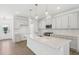 Modern kitchen featuring white cabinets, stainless steel appliances, and a large center island at 269 Marvel Dr # 138, Rolesville, NC 27571