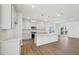 Bright, open kitchen with gray cabinets, stainless appliances, and an island with pendant lighting at 269 Marvel Dr # 138, Rolesville, NC 27571