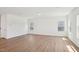 Expansive living room showcasing hardwood floors and natural light from multiple windows at 269 Marvel Dr # 138, Rolesville, NC 27571