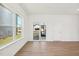 Bright living room with hardwood floors, a sliding glass door, and a large picture window at 269 Marvel Dr # 138, Rolesville, NC 27571