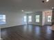 Bright and airy living room featuring luxury vinyl flooring and multiple windows for abundant natural light at 269 Marvel Dr # 138, Rolesville, NC 27571