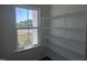 Walk-in pantry featuring wire shelving and a window that provides natural light at 269 Marvel Dr # 138, Rolesville, NC 27571