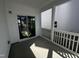 Covered back patio with white railing and siding, perfect for outdoor relaxation and entertaining at 269 Marvel Dr # 138, Rolesville, NC 27571