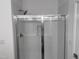 Modern walk-in shower with glass door, white subway tile, and chrome fixtures at 269 Marvel Dr # 138, Rolesville, NC 27571
