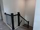 Staircase with black wrought iron railing leading to the upper level of the home at 269 Marvel Dr # 138, Rolesville, NC 27571