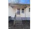 Exterior back entrance featuring a canopy, steps, and access to the house at 2711 Ashe St, Durham, NC 27703