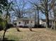 Backyard showing some trees and large area at 2711 Ashe St, Durham, NC 27703