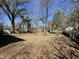 Large backyard showcasing some large trees at 2711 Ashe St, Durham, NC 27703