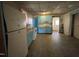 This kitchen features classic appliances, blue cabinetry, and durable tiled flooring at 2711 Ashe St, Durham, NC 27703