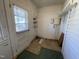 Mud room includes tile flooring, ample natural light, and convenient access to the exterior at 2711 Ashe St, Durham, NC 27703