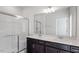 Bathroom featuring double sinks, a large mirror and a glass enclosed shower at 280 Chesapeake Commons St # 151, Garner, NC 27529