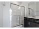 Modern bathroom features a glass-enclosed shower, vanity with a sink and a large mirror at 280 Chesapeake Commons St # 151, Garner, NC 27529
