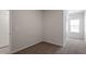 Bedroom with neutral walls, plush carpeting, and a view through the window at 280 Chesapeake Commons St # 151, Garner, NC 27529