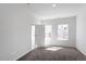 Bright bedroom features plush carpeting, neutral walls, and ample natural light from the double window at 280 Chesapeake Commons St # 151, Garner, NC 27529