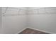 Walk-in closet with wire shelving and neutral carpeting for storage solutions at 280 Chesapeake Commons St # 151, Garner, NC 27529
