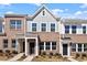 Charming brick townhomes with well-maintained landscaping and inviting front entrances offer curb appeal at 280 Chesapeake Commons St # 151, Garner, NC 27529